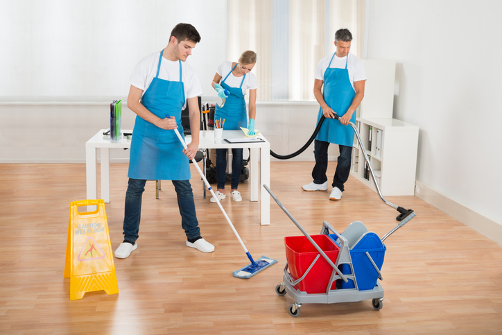 Professional cleaners are mopping to ensure and maintain cleanliness in high-traffic areas during the winter season.