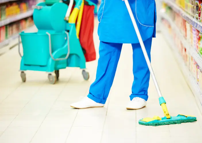 A professional cleaner is mopping the floors of retail spaces to give them a fresh look and attract more customers this summer.