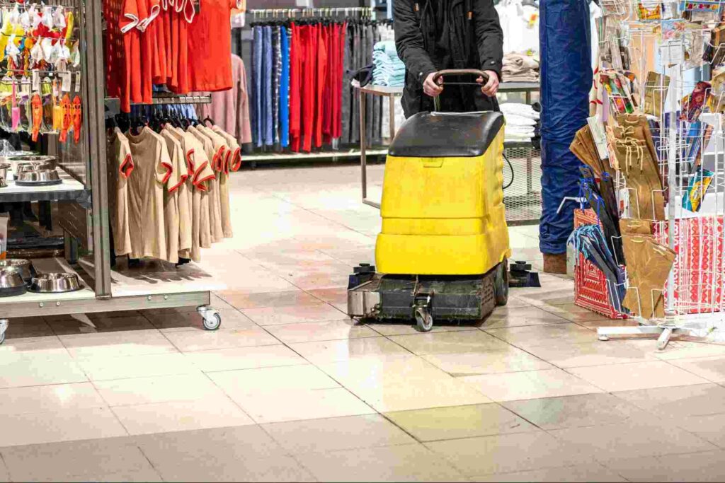 Retail store cleaning services using a commercial floor scrubber to clean and maintain high-traffic retail flooring for a safe and professional shopping environment.